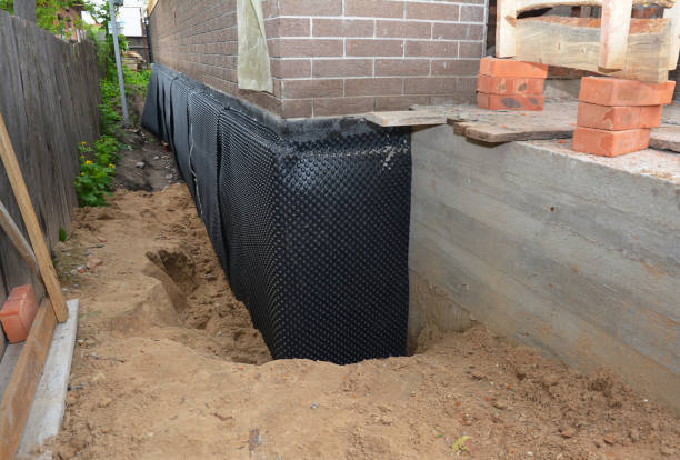 Happy homeowners after waterproofing job in Crane